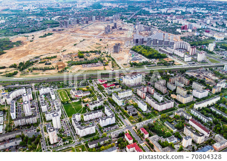 top view of the construction site and the city.The City Of Minsk.Start of new construction of a microdistrict in Minsk top view of the construction site and the city.The City Of Minsk.Start of new construction of a microdistrict in Minsk 70804328