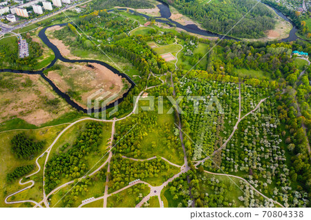 View from the height of the loshitsky Park in Minsk.Winding paths in loshitsky Park.Belarus.Apple orchard View from the height of the loshitsky Park in Minsk.Winding paths in loshitsky Park.Belarus.Apple orchard 70804338