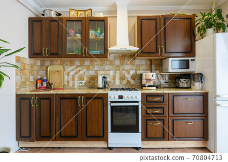Kitchen set for dark wood in a standard apartment Kitchen set for dark wood in a standard apartment 70804713