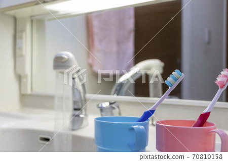 Toothpaste tools placed on the washbasin Toothpaste tools placed on the washbasin 70810158