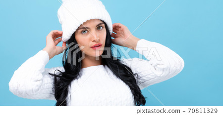 Young woman in a cold weather winter outfit Young woman in a cold weather winter outfit 70811329