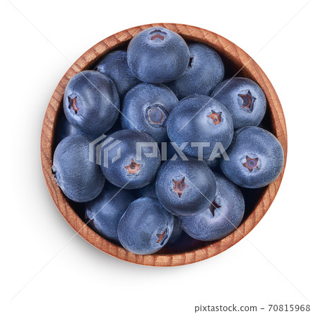 fresh ripe blueberry in wooden bowl isolated on white background with clipping path . Top view. Flat lay pattern fresh ripe blueberry in wooden bowl isolated on white background with clipping path . Top view. Flat lay pattern 70815968