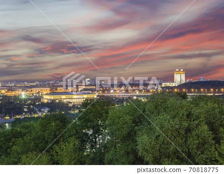 view of central Moscow from Sparrow Hills or Vorobyovy Gory observation (viewing) platform at sunset-- is on a steep bank 85 m above the Moskva river, or 200 m above sea level. Russia view of central Moscow from Sparrow Hills or Vorobyovy Gory observation (viewing) platform at sunset-- is on a steep bank 85 m above the Moskva river, or 200 m above sea level. Russia 70818775