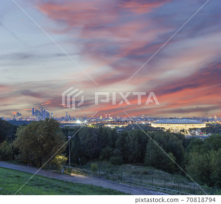 view of central Moscow from Sparrow Hills or Vorobyovy Gory observation (viewing) platform at sunset-- is on a steep bank 85 m above the Moskva river, or 200 m above sea level. Russia 70818794