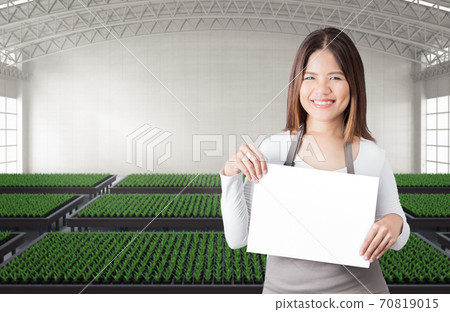 Happy female gardener Happy female gardener 70819015
