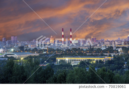 view of central Moscow from Sparrow Hills or Vorobyovy Gory observation (viewing) platform at sunset-- is on a steep bank 85 m above the Moskva river, or 200 m above sea level. Russia 70819061