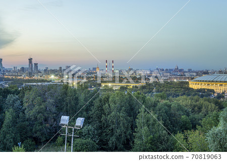 view of central Moscow from Sparrow Hills or Vorobyovy Gory observation (viewing) platform at sunset-- is on a steep bank 85 m above the Moskva river, or 200 m above sea level. Russia 70819063