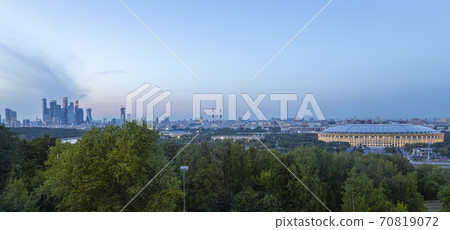 view of central Moscow from Sparrow Hills or Vorobyovy Gory observation (viewing) platform at sunset-- is on a steep bank 85 m above the Moskva river, or 200 m above sea level. Russia view of central Moscow from Sparrow Hills or Vorobyovy Gory observation (viewing) platform at sunset-- is on a steep bank 85 m above the Moskva river, or 200 m above sea level. Russia 70819072
