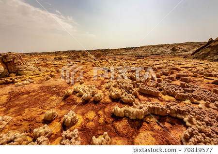 The scenery and sky of strangely shaped and colored rocks that I saw on the way to Dallol volcano on a tour of the Danakil Desert in Ethiopia 70819577