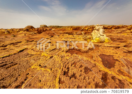The scenery and sky of strangely shaped and colored rocks that I saw on the way to Dallol volcano on a tour of the Danakil Desert in Ethiopia 70819579