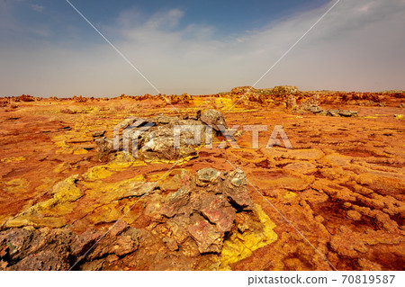 The scenery and sky of strangely shaped and colored rocks that I saw on the way to Dallol volcano on a tour of the Danakil Desert in Ethiopia 70819587