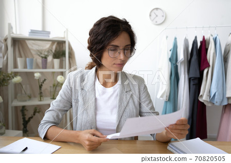 Caucasian woman read news in post paper letter Caucasian woman read news in post paper letter 70820505