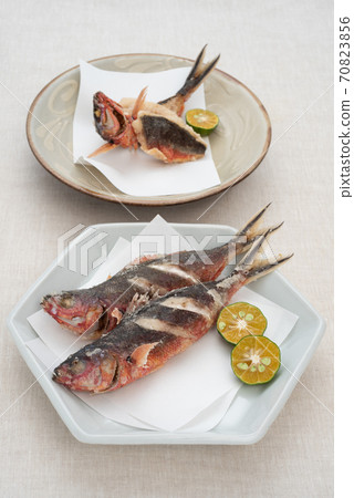 Deep-fried Okinawan prefectural fish Gurukun and 2 kinds of Shikuwasa Deep-fried Okinawan prefectural fish Gurukun and 2 kinds of Shikuwasa 70823856