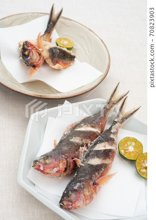 Deep-fried Okinawan prefectural fish Gurukun and 2 kinds of Shikuwasa Deep-fried Okinawan prefectural fish Gurukun and 2 kinds of Shikuwasa 70823903