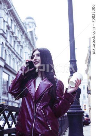 young pretty girl outside in city street with coffee happy smiling, lifestyle fashion peopple concept young pretty girl outside in city street with coffee happy smiling, lifestyle fashion peopple concept 70825306