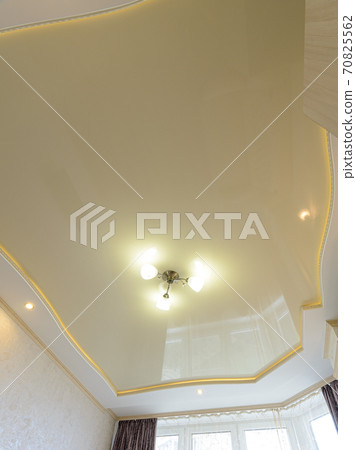 View of the beautiful rich stretch ceiling of the original form in the interior of the bedroom View of the beautiful rich stretch ceiling of the original form in the interior of the bedroom 70825562