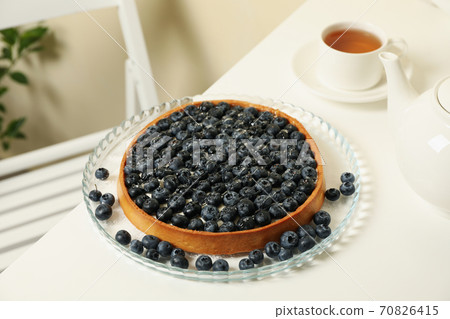 Concept of tasty breakfast with blueberry pie on white table Concept of tasty breakfast with blueberry pie on white table 70826415