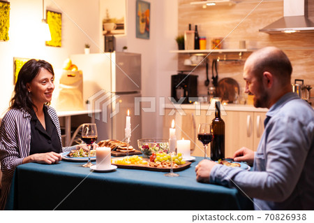 Enjoying romantic dinner Enjoying romantic dinner 70826938
