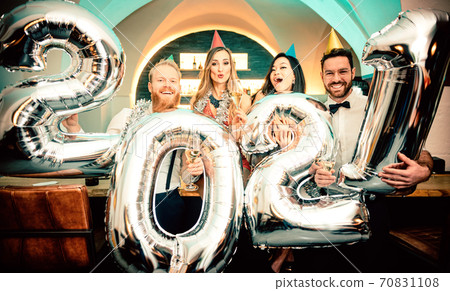 Party people women and men celebrating new years eve 2021 Party people women and men celebrating new years eve 2021 70831108