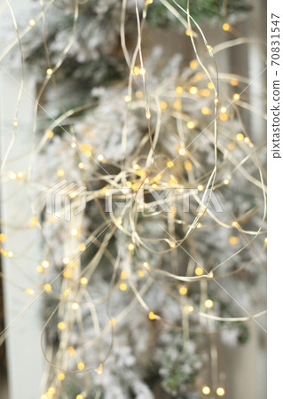 Christmas tree blur garland close-up New year background Christmas tree blur garland close-up New year background 70831547