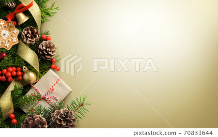 Christmas border composition made of fir branches, cones and gift box on light golden background 70831644