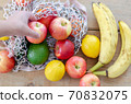 Different seasonal fruits :Apple,banana,avocado, lemon and peach 70832075