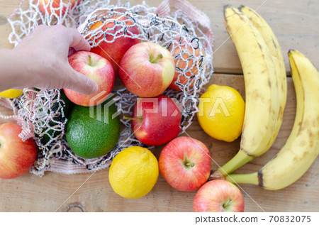 Different seasonal fruits :Apple,banana,avocado, lemon and peach 70832075