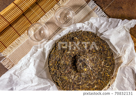 Shen Puerh, Traditional Chinese Tea, for copy space. the Chinese dry the tea. the view from the top Shen Puerh, Traditional Chinese Tea, for copy space. the Chinese dry the tea. the view from the top 70832131