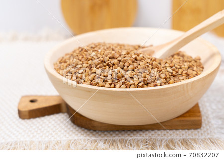Buckwheat grain dry buckwheat. Close-up of brown buckwheat groats. Healthy food. 70832207