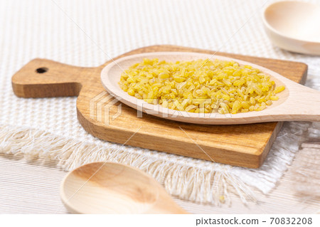 raw grain Bulgur porridge. Healthy, dietary, vegan, gluten free product. Organic product made from wheat grains. Close-up. raw grain Bulgur porridge. Healthy, dietary, vegan, gluten free product. Organic product made from wheat grains. Close-up. 70832208