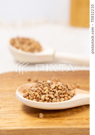 buckwheat macro view on rustic background. gluten free ancient grain for healthy diet. vertical photo buckwheat macro view on rustic background. gluten free ancient grain for healthy diet. vertical photo 70832210