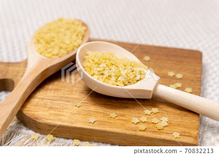 Star shaped noodles. Italian pasta for soup, stelline. close up Star shaped noodles. Italian pasta for soup, stelline. close up 70832213