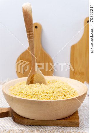Raw Stelline macaroni in a bowl. vertical photo 70832214