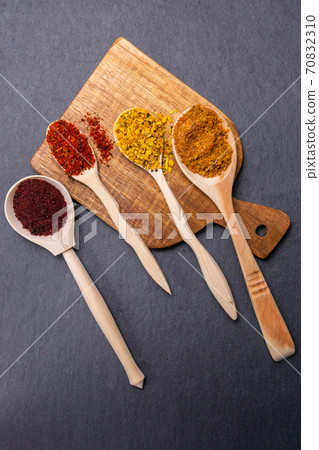 spices and herbs on a dark background. Food and kitchen ingredients. vertical photo spices and herbs on a dark background. Food and kitchen ingredients. vertical photo 70832310