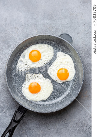 Sunny side up eggs in skillet 70832709