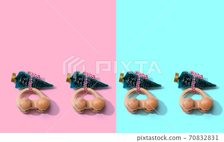 Wooden toy cars carrying Christmas trees 70832831