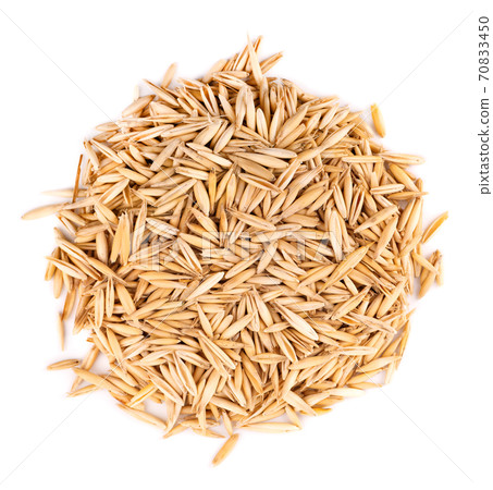Unpeeled oat grains, isolated on white background. Organic dry oat seeds. Top view. Unpeeled oat grains, isolated on white background. Organic dry oat seeds. Top view. 70833450
