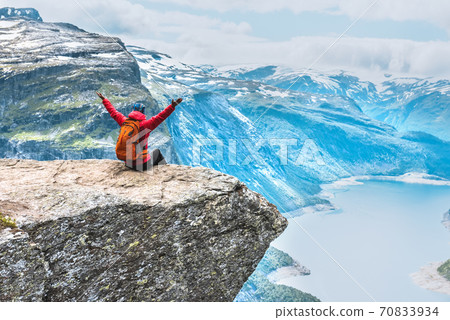 Sporty woman posing on Trolltunga Norway Sporty woman posing on Trolltunga Norway 70833934