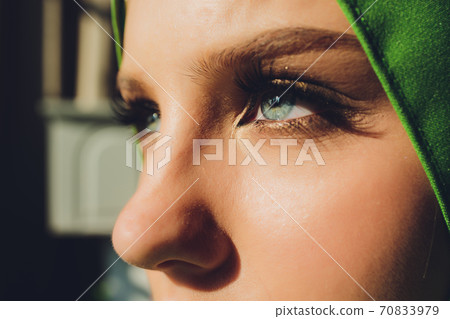 Portrait of a beautiful, elegant and attractive young Malay Asian Muslim woman in a dress and an hijab head scarf. Portrait of a beautiful, elegant and attractive young Malay Asian Muslim woman in a dress and an hijab head scarf. 70833979