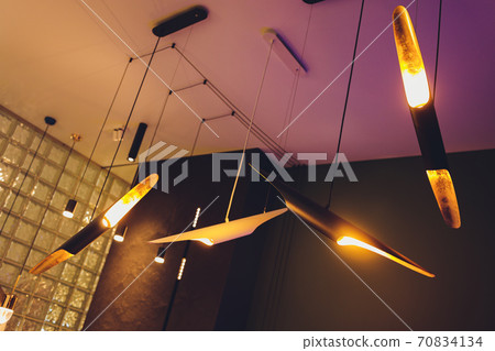 Chandelier made of unusual shapes. Designer Chandelier. Lighting fixture. Chandelier made of unusual shapes. Designer Chandelier. Lighting fixture. 70834134