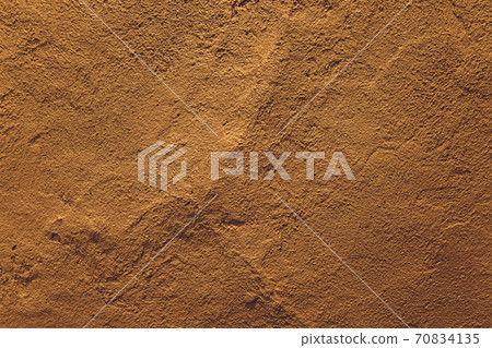 dark yellow grunge cement wall, textured background. dark yellow grunge cement wall, textured background. 70834135