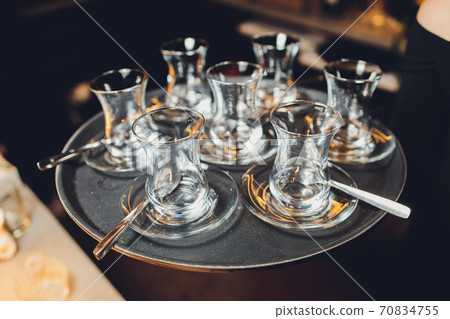 moroccan tea tray, tea pot and glass on tray, Moroccan hospitality. 70834755