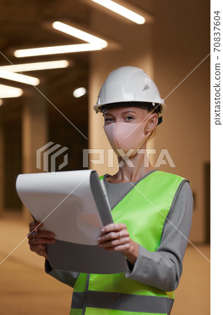Female Worker Wearing Mask at Plant 70837604