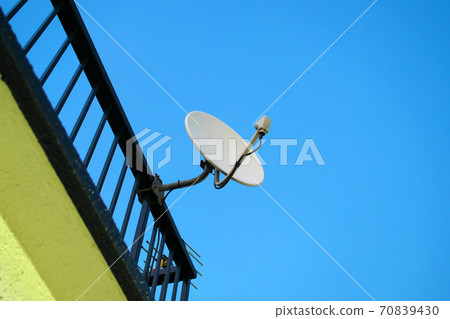 Parabolic antenna with blue sky background Parabolic antenna with blue sky background 70839430