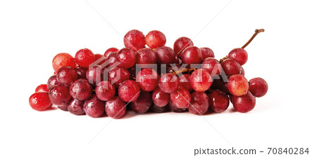 Bunch of ripe sweet pink grapes with water drops isolated on white background. Bunch of ripe sweet pink grapes with water drops isolated on white background. 70840284