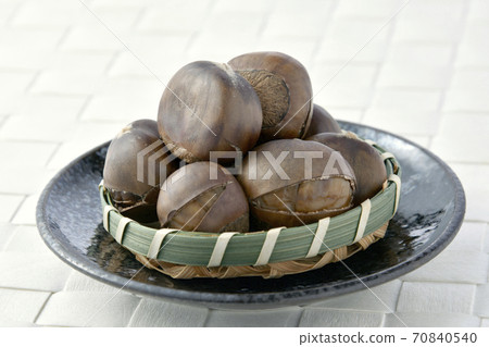 Grilled chestnuts on a plate Grilled chestnuts on a plate 70840540