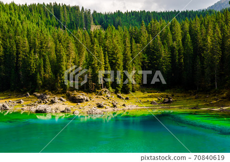 Beautiful view of famous Carezza lake at dolomite mountain, Ital 70840619