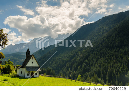 Beautiful view of church and famous dolomite mountain, Italy. Beautiful view of church and famous dolomite mountain, Italy. 70840629