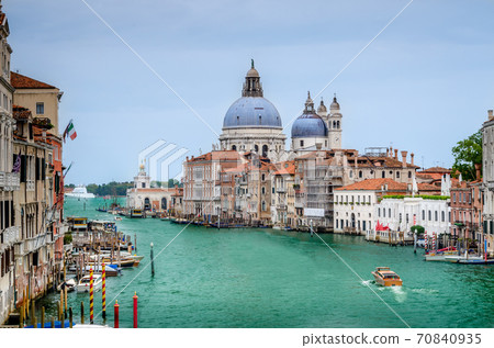 The Basilica of St Mary of Health or Basilica di Santa Maria della Salute at grand canal in Venice, Italy The Basilica of St Mary of Health or Basilica di Santa Maria della Salute at grand canal in Venice, Italy 70840935