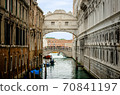 Famous Bridge of Sighs. The enclosed bridge is made of white limestone connect Doge's Palace and new prison. 70841197